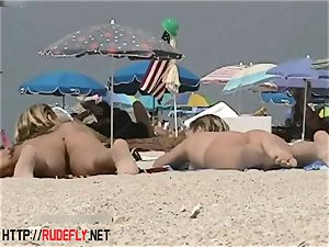 towheaded model naturist on the bare beach hidden cam movie